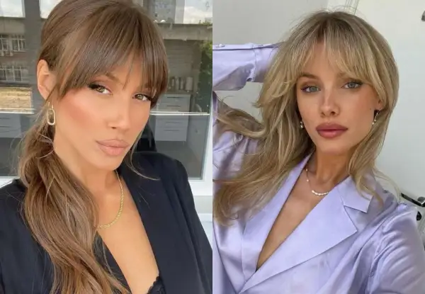 Dos mujeres con flequillo cortina. La de la izquierda, morena, lleva un blazer negro. La de la derecha, rubia, viste un blazer lila.